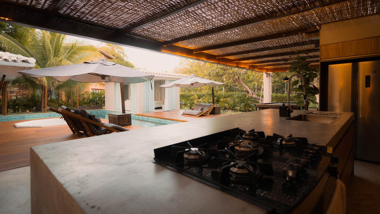 Cooktop and Poolside — Illustrious Renovations project